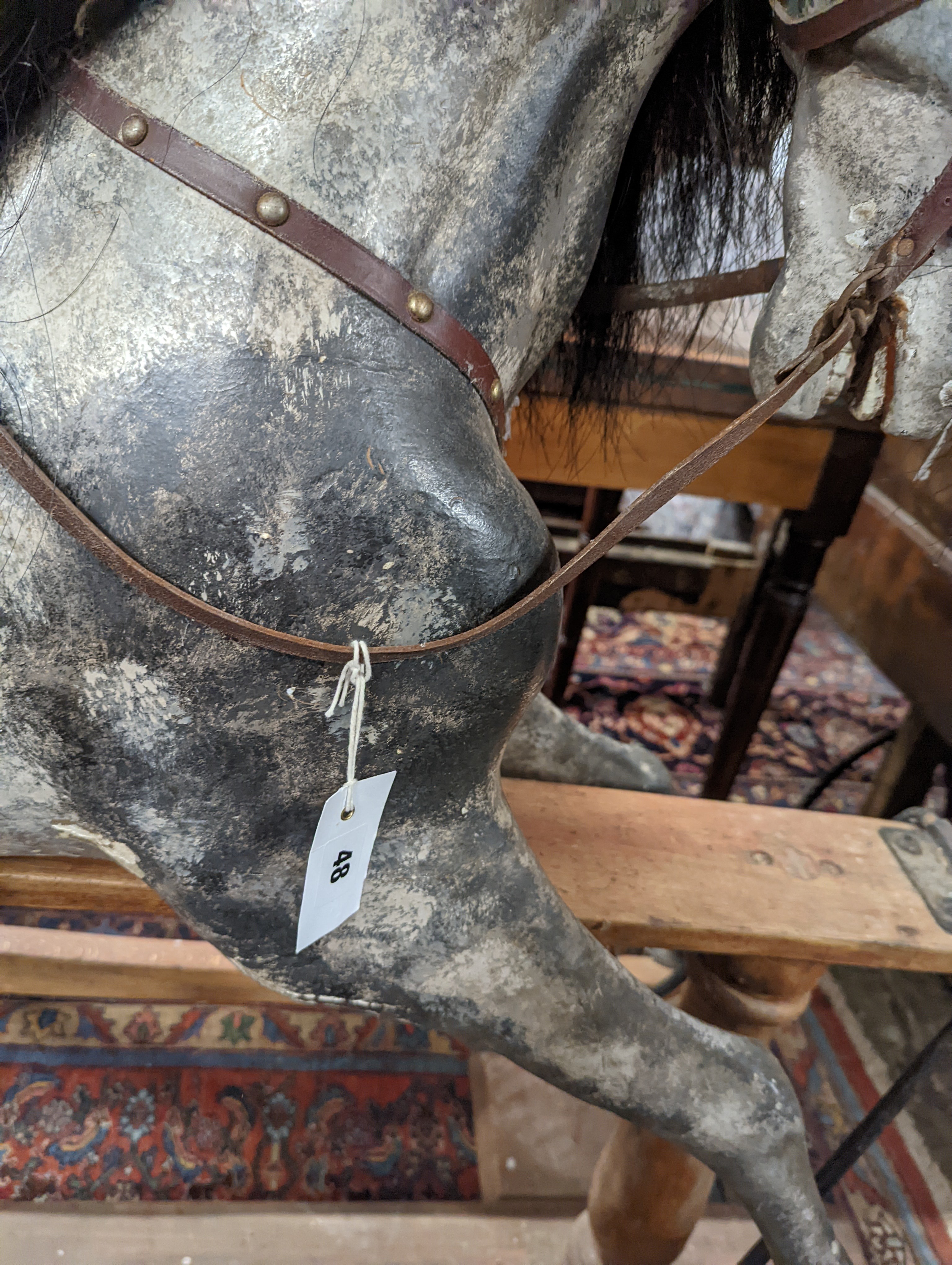 A large Edwardian Ayres type rocking horse on a turned safety frame, length 160cm, height 110cm